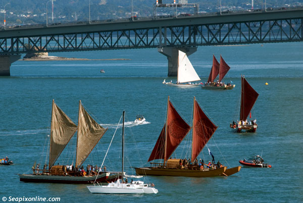 Anyone gazing across Auckland's Waitemata Harbour today could have been forgiven for thinking the next great wave of Polynesian migration had begun.

Four traditional ocean-going vaka (waka), each carrying a crew of around 16, sailed around the Auckland's inner harbour, their skippers fine tuning their vessels in readiness for their departure on Wednesday 14th April (providing the weather gods are in benevolent mood) for an epic Pacific passage to French Polynesia, Cook Islands, Samoa, Tonga and Fiji.

The four vaka, seen here with the classic 1898-built Arch Logan gaff cutter RAINBOW (A7) off Ngataringa Bay near the Auckland Harbour Bridge, were constructed at the Salthouse boatyard in Greenhithe, Auckland and utilise modern construction techniques and technology (two of the vessels use solar energy to power auxilliary propulsion systems) as well as traditional rope lashings. The hulls are made of E-glass and foam.

The idea for today's regatta and upcoming Pacific voyages are the brainchild of German philanthropic organisation Okeanos, a group dedicated to highlighting the environmental pressures and threats affecting the world's oceans.

The upcoming ocean voyage is aimed at re-establishing cultural links and highlighting key environmental issues affecting the island nations of the Pacific and their peoples. 

One vaka will remain behind at each of the destinations visited by the fleet, that vessel to be used for crew training. It will also be used for cultural and educational purposes.

The four vaka sailing in today's Te Kumete O Te Moana regatta were Te Matua a Maui (NZ crew) Hine Moana (Western Samoa, Vanuatu, Tongan crew), Uto Ni Yalo (Fijian crew)  and Maramaru Atua (Cook Island crew). A fifth vaka, Faafaite, will join the fleet en-route in Tahiti.

A much longer Pacific voyage will take place next year when Auckland will host a gathering of seven of these magnificent vessels prior to their departure for Hawaii via French Polynesia.
 11 April 2010. Photo by SeapixOnline.com/Trevor Coppock